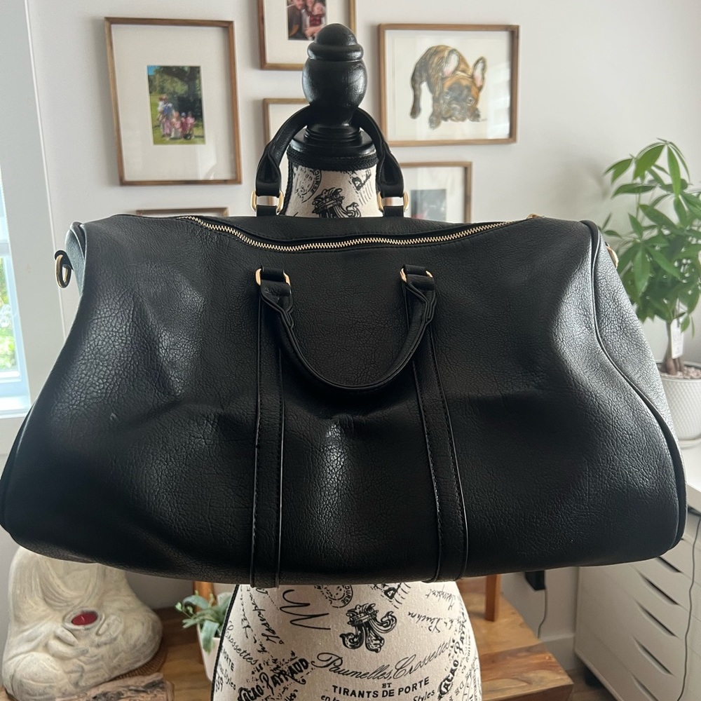 Vegan leather carryall in black with gold hardware. New condition.
